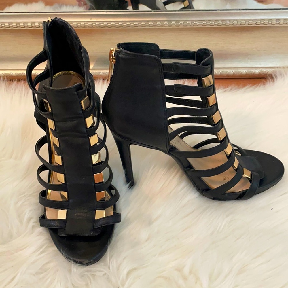 Strapping black cage high heels with gold detail